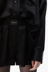 alexander wang logo detailed button up boxer short romper in silk black